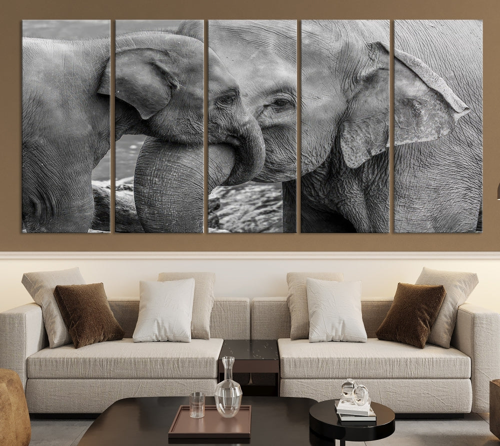 The Elephant Family Wall Art Canvas Print, depicting a black and white triptych of elephants embracing, is a museum-quality piece meticulously hand-assembled into framed art. This elegant canvas combines sophistication with the convenience of free shipping.