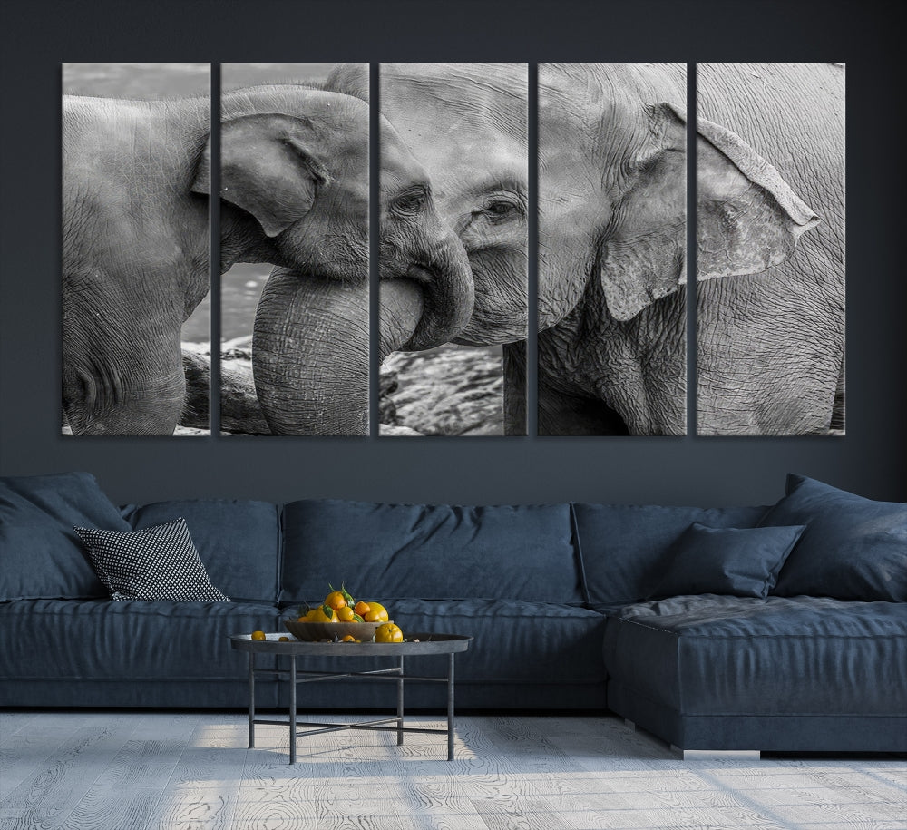 The Elephant Family Wall Art Canvas Print, depicting a black and white triptych of elephants embracing, is a museum-quality piece meticulously hand-assembled into framed art. This elegant canvas combines sophistication with the convenience of free shipping.