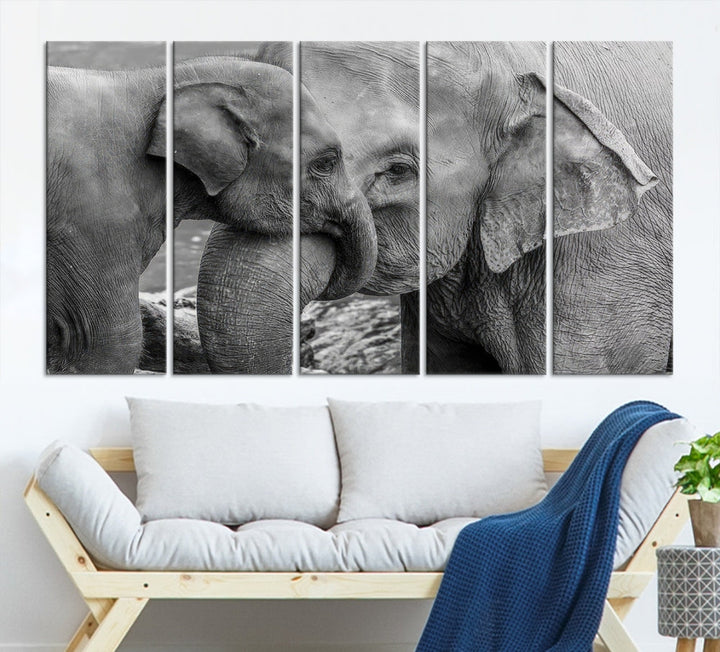 The Elephant Family Wall Art Canvas Print, depicting a black and white triptych of elephants embracing, is a museum-quality piece meticulously hand-assembled into framed art. This elegant canvas combines sophistication with the convenience of free shipping.