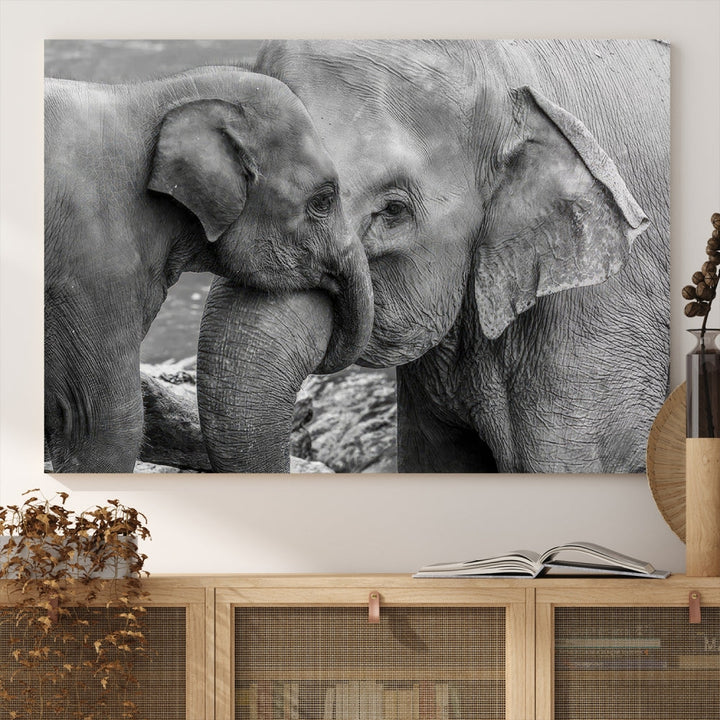 The Elephant Family Wall Art Canvas Print, depicting a black and white triptych of elephants embracing, is a museum-quality piece meticulously hand-assembled into framed art. This elegant canvas combines sophistication with the convenience of free shipping.