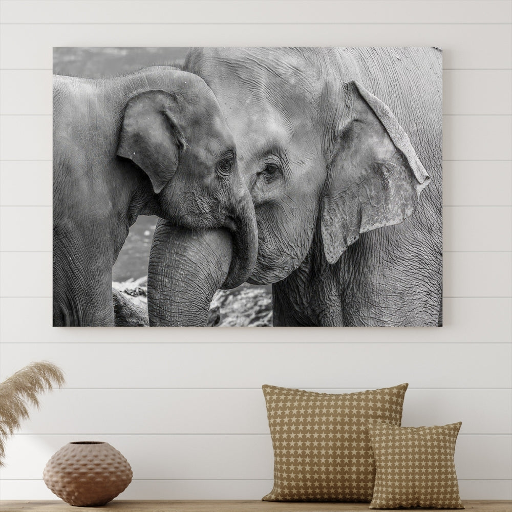 The Elephant Family Wall Art Canvas Print, depicting a black and white triptych of elephants embracing, is a museum-quality piece meticulously hand-assembled into framed art. This elegant canvas combines sophistication with the convenience of free shipping.