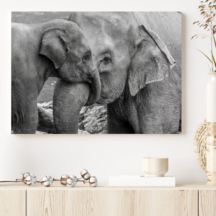 The Elephant Family Wall Art Canvas Print, depicting a black and white triptych of elephants embracing, is a museum-quality piece meticulously hand-assembled into framed art. This elegant canvas combines sophistication with the convenience of free shipping.