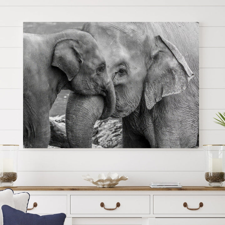 The Elephant Family Wall Art Canvas Print, depicting a black and white triptych of elephants embracing, is a museum-quality piece meticulously hand-assembled into framed art. This elegant canvas combines sophistication with the convenience of free shipping.