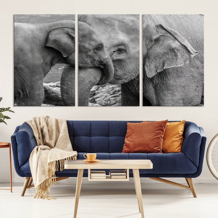 The Elephant Family Wall Art Canvas Print, depicting a black and white triptych of elephants embracing, is a museum-quality piece meticulously hand-assembled into framed art. This elegant canvas combines sophistication with the convenience of free shipping.