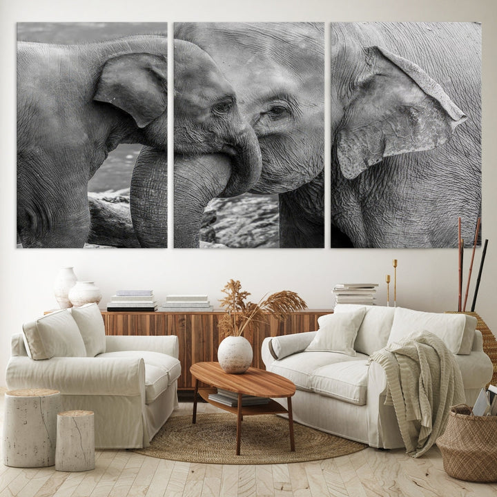 The Elephant Family Wall Art Canvas Print, depicting a black and white triptych of elephants embracing, is a museum-quality piece meticulously hand-assembled into framed art. This elegant canvas combines sophistication with the convenience of free shipping.