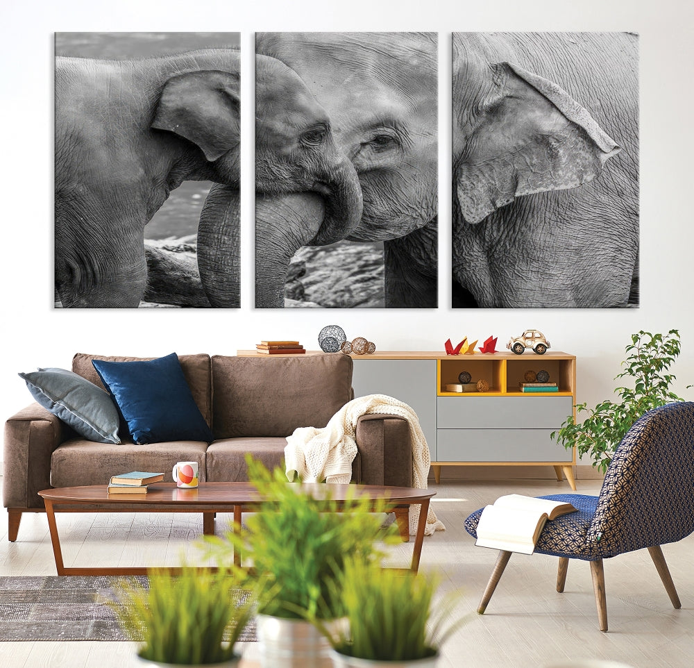 The Elephant Family Wall Art Canvas Print, depicting a black and white triptych of elephants embracing, is a museum-quality piece meticulously hand-assembled into framed art. This elegant canvas combines sophistication with the convenience of free shipping.