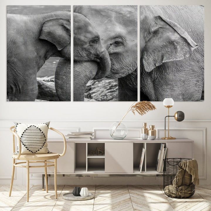 The Elephant Family Wall Art Canvas Print, depicting a black and white triptych of elephants embracing, is a museum-quality piece meticulously hand-assembled into framed art. This elegant canvas combines sophistication with the convenience of free shipping.