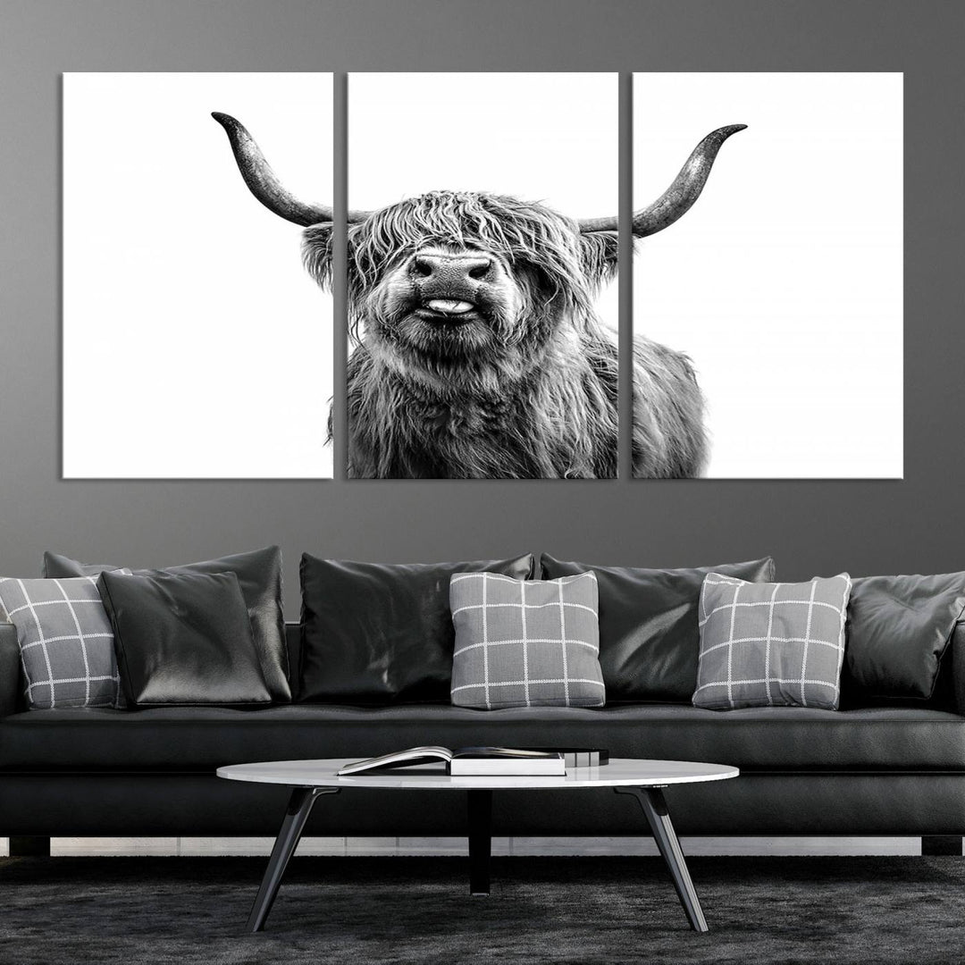 The living room features the Fanny Scottish Highland Cow Cattle Art Print Farmhouse Wall Art Canvas Print, a three-panel museum-quality artwork displayed against a dark wall.