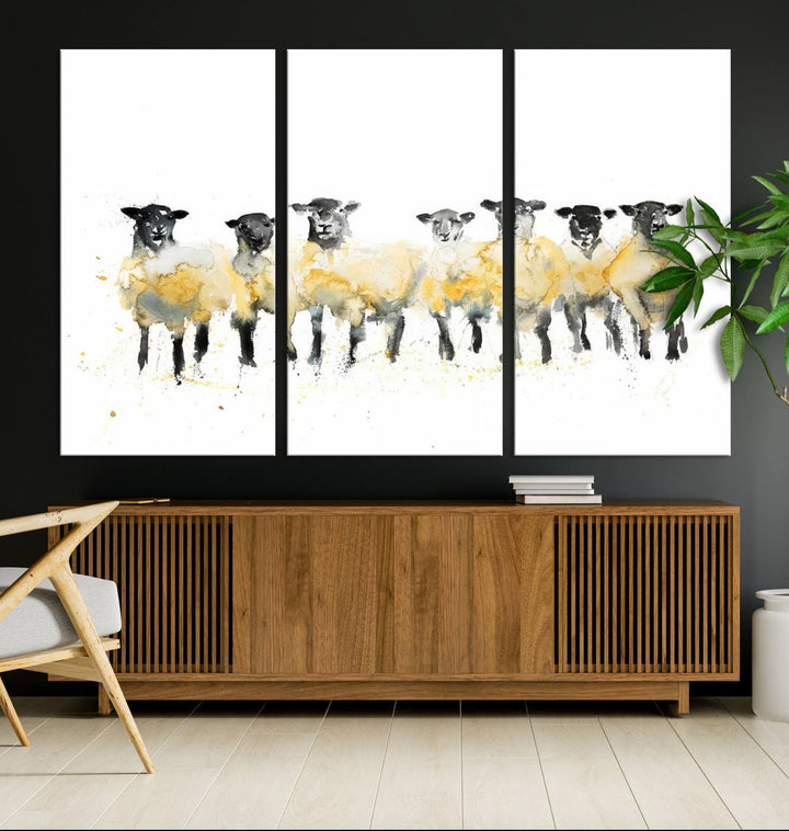 The Farmhouse Wall Art Sheep Print, ready to hang as a framed canvas, adorns the black wall, adding a hint of rustic barn decor.