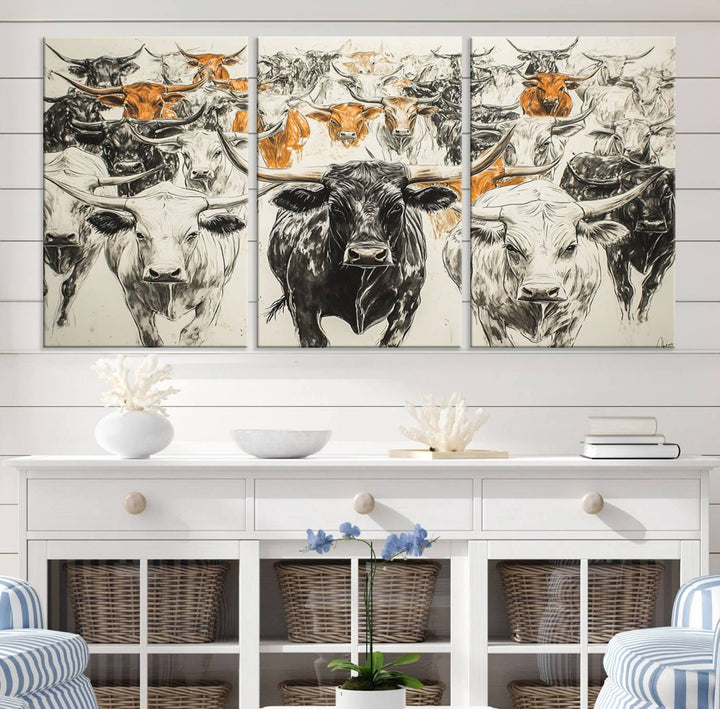 This exquisite farmhouse wall art, titled "Western Longhorn Cattle Canvas Print," showcases a majestic herd of longhorn cattle in a three-panel design. This ready-to-hang and framed barn decor infuses your space with rustic charm.