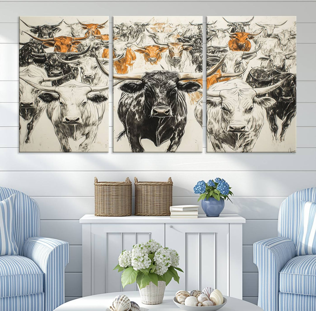 This exquisite farmhouse wall art, titled "Western Longhorn Cattle Canvas Print," showcases a majestic herd of longhorn cattle in a three-panel design. This ready-to-hang and framed barn decor infuses your space with rustic charm.