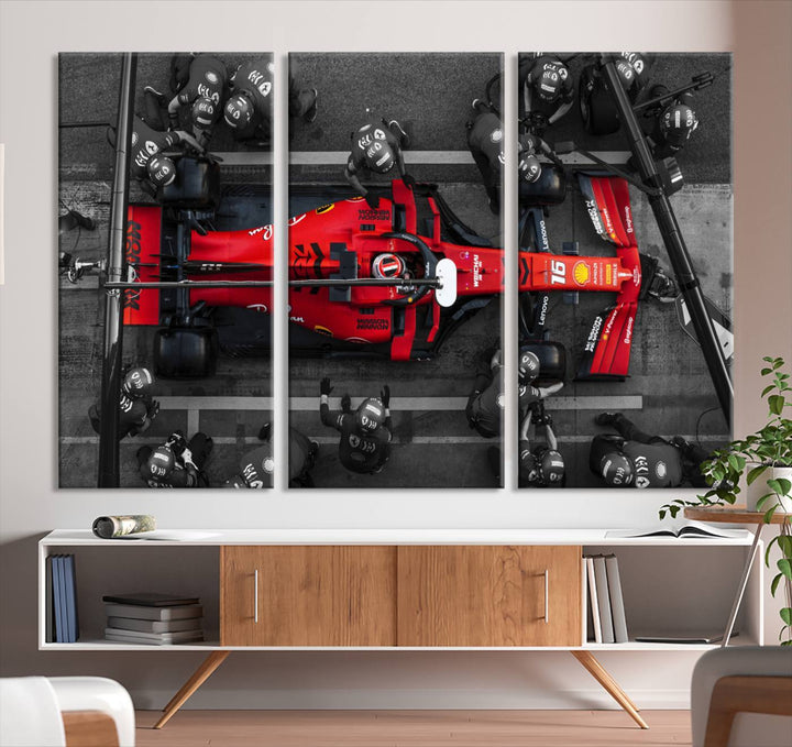 The Ferrari Pit Stop Canvas Wall Art features bold motorsport imagery that captures the precision and speed of Formula 1.