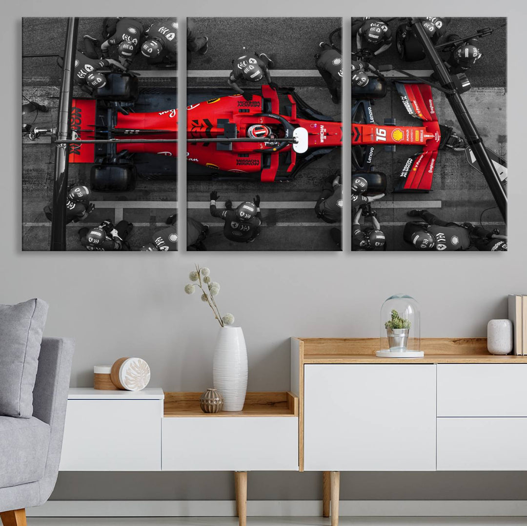 The Ferrari Pit Stop Canvas Wall Art features bold motorsport imagery that captures the precision and speed of Formula 1.