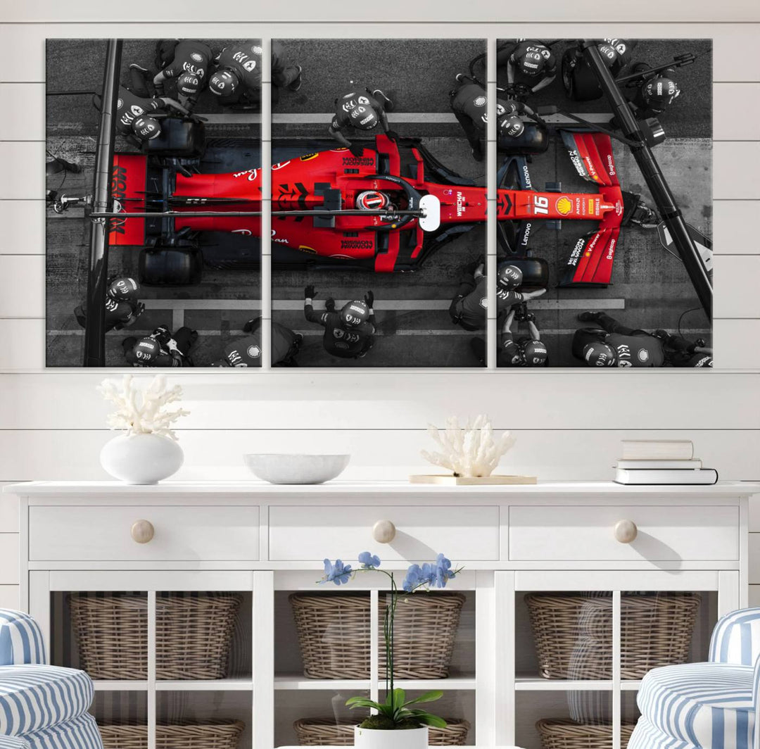 The Ferrari Pit Stop Canvas Wall Art features bold motorsport imagery that captures the precision and speed of Formula 1.