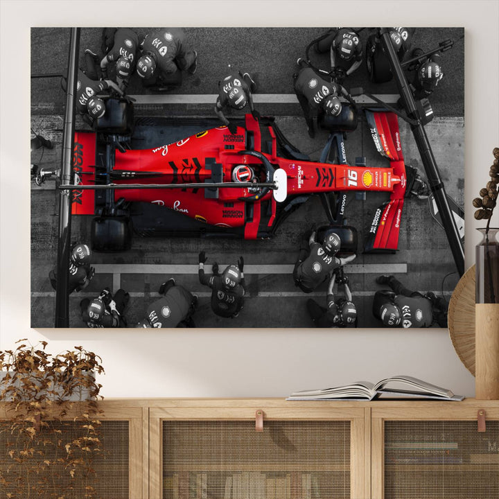 The Ferrari Pit Stop Canvas Wall Art features bold motorsport imagery that captures the precision and speed of Formula 1.