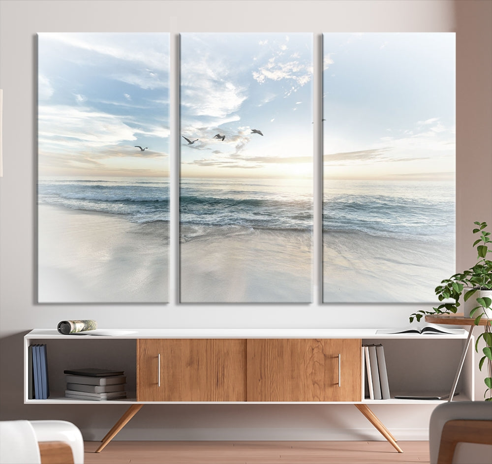 The Flight Over Coastal Beach Landscape Photography Print, a triptych of a serene ocean and sky scene with seagulls on museum-quality canvas, captivates as it hangs prominently in any space. Enjoy free shipping on this captivating piece that transforms any room into a tranquil retreat.