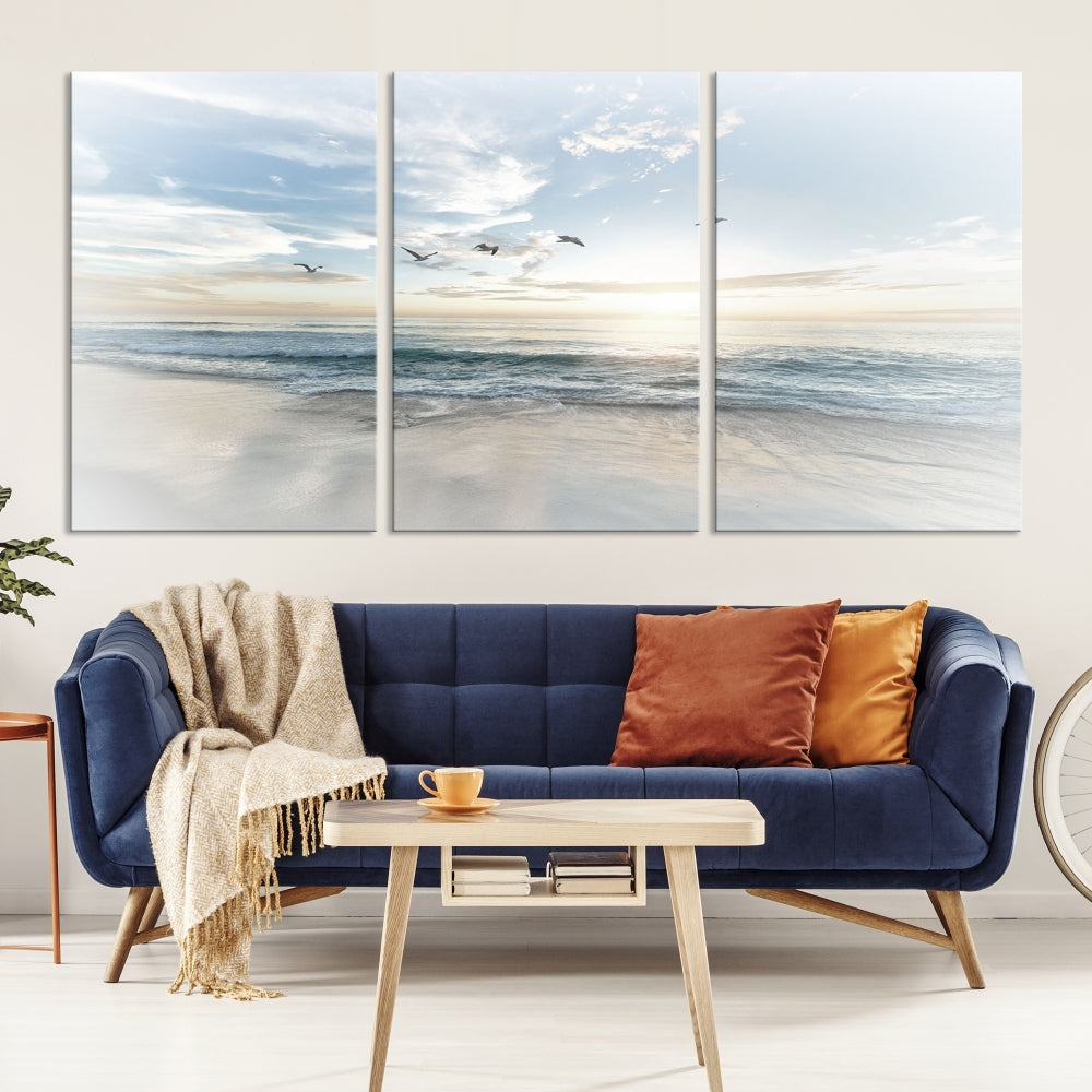 The Flight Over Coastal Beach Landscape Photography Print, a triptych of a serene ocean and sky scene with seagulls on museum-quality canvas, captivates as it hangs prominently in any space. Enjoy free shipping on this captivating piece that transforms any room into a tranquil retreat.