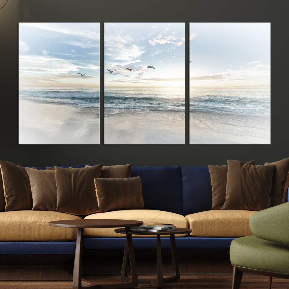 The Flight Over Coastal Beach Landscape Photography Print, a triptych of a serene ocean and sky scene with seagulls on museum-quality canvas, captivates as it hangs prominently in any space. Enjoy free shipping on this captivating piece that transforms any room into a tranquil retreat.