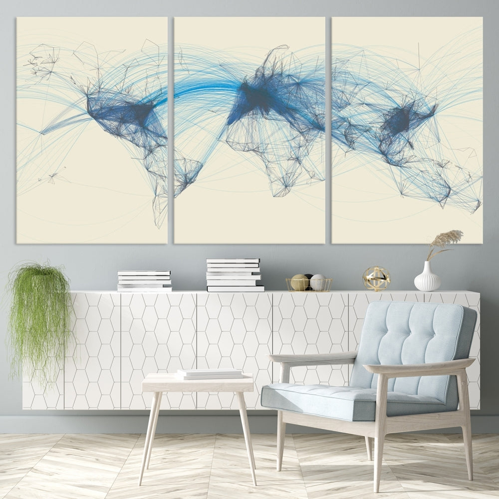 The Flight Routes Map art, featuring an abstract world map with blue connections representing global networks, is a three-panel canvas wall art piece.