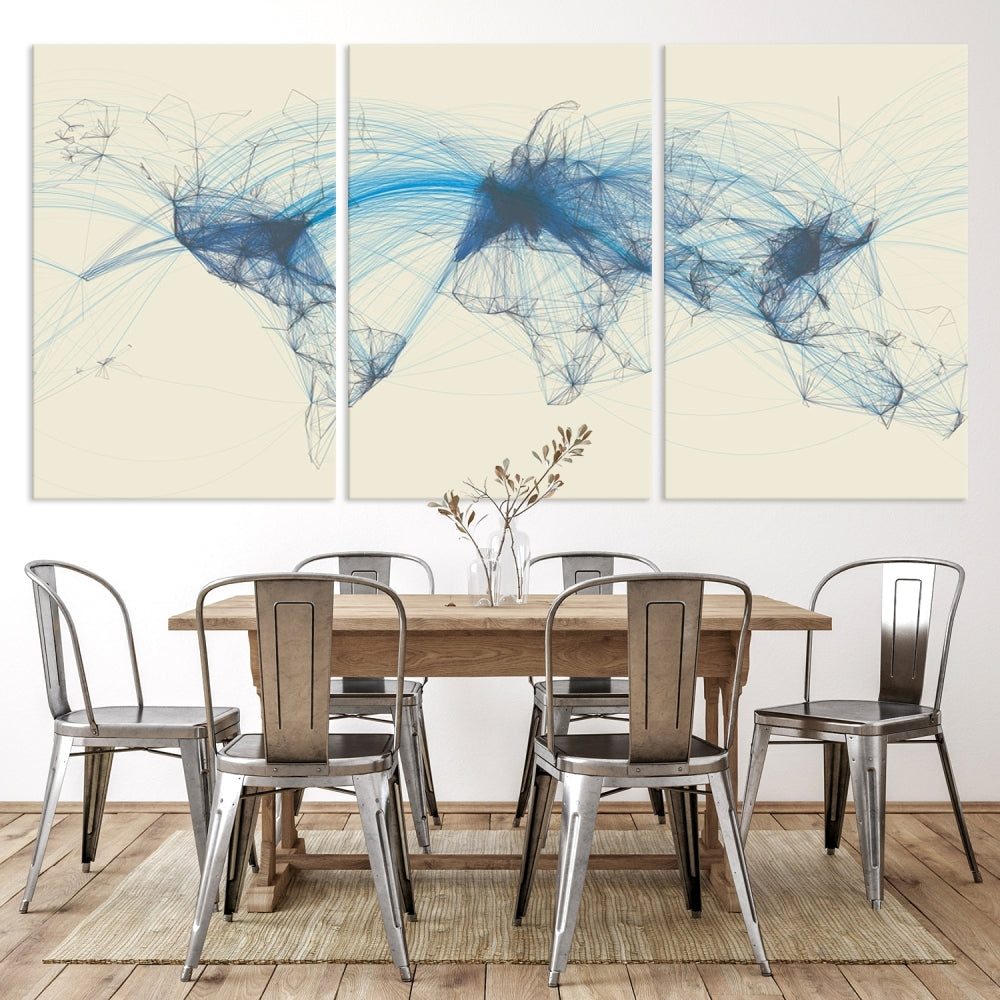 The Flight Routes Map art, featuring an abstract world map with blue connections representing global networks, is a three-panel canvas wall art piece.