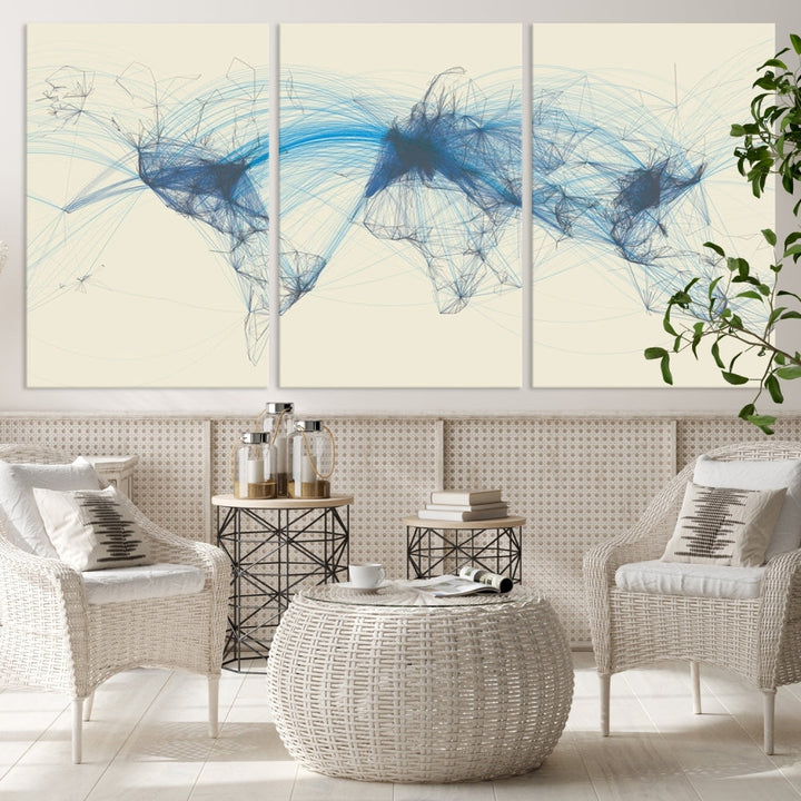 The Flight Routes Map art, featuring an abstract world map with blue connections representing global networks, is a three-panel canvas wall art piece.