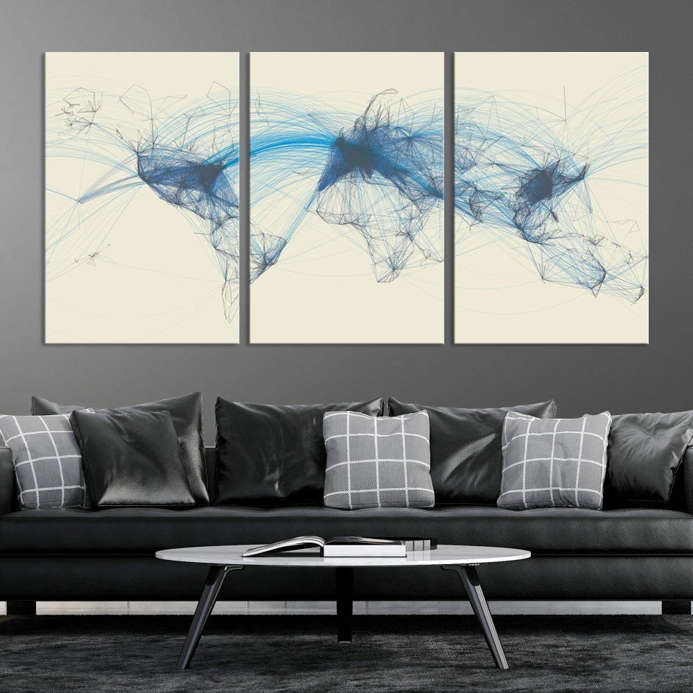 The Flight Routes Map art, featuring an abstract world map with blue connections representing global networks, is a three-panel canvas wall art piece.