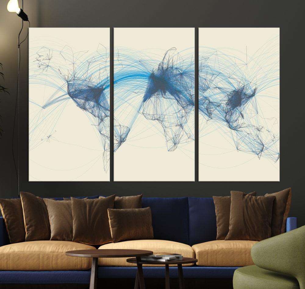 The Flight Routes Map art, featuring an abstract world map with blue connections representing global networks, is a three-panel canvas wall art piece.