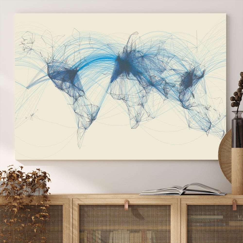 The Flight Routes Map art, featuring an abstract world map with blue connections representing global networks, is a three-panel canvas wall art piece.