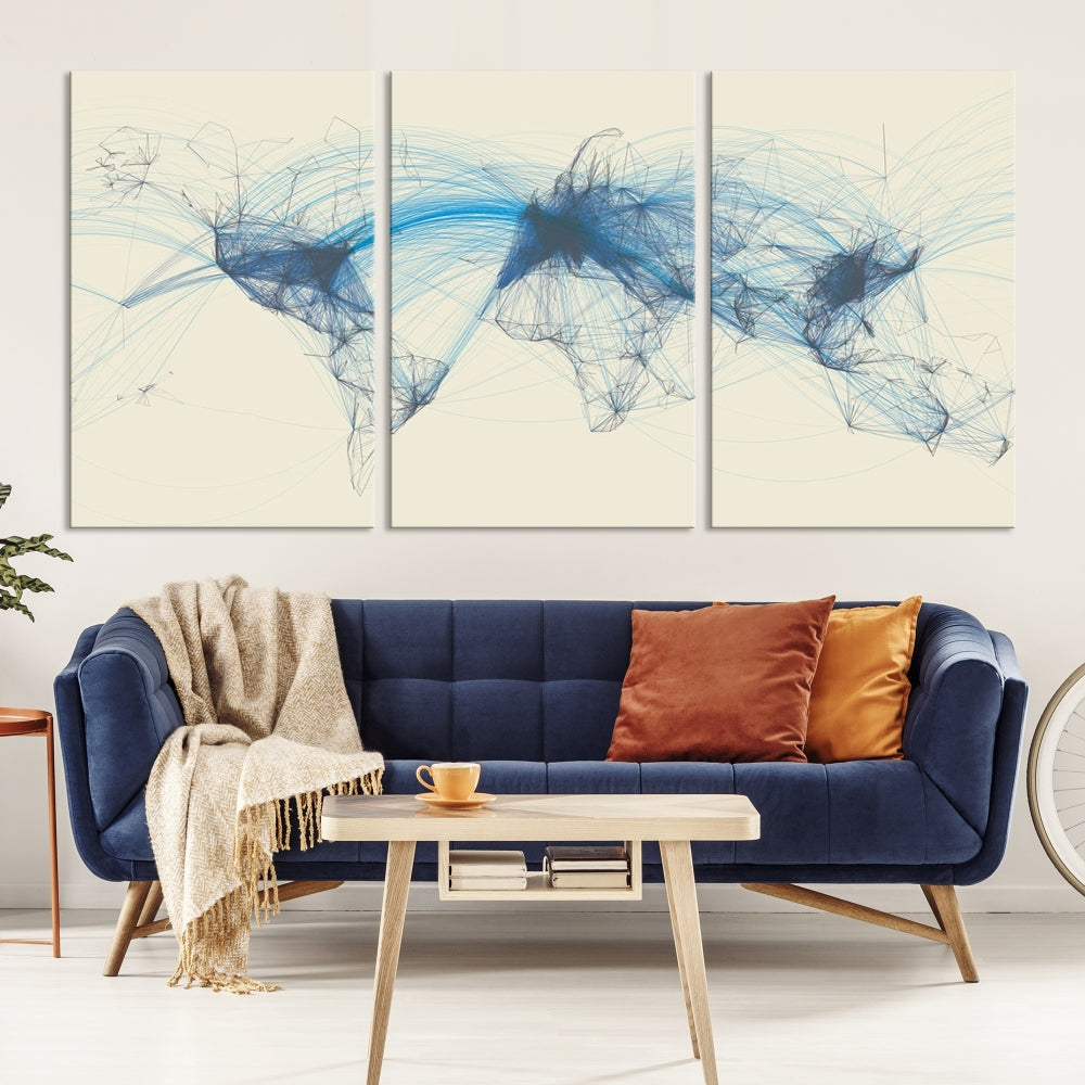 The Flight Routes Map art, featuring an abstract world map with blue connections representing global networks, is a three-panel canvas wall art piece.