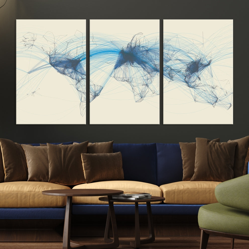 The Flight Routes Map art, featuring an abstract world map with blue connections representing global networks, is a three-panel canvas wall art piece.