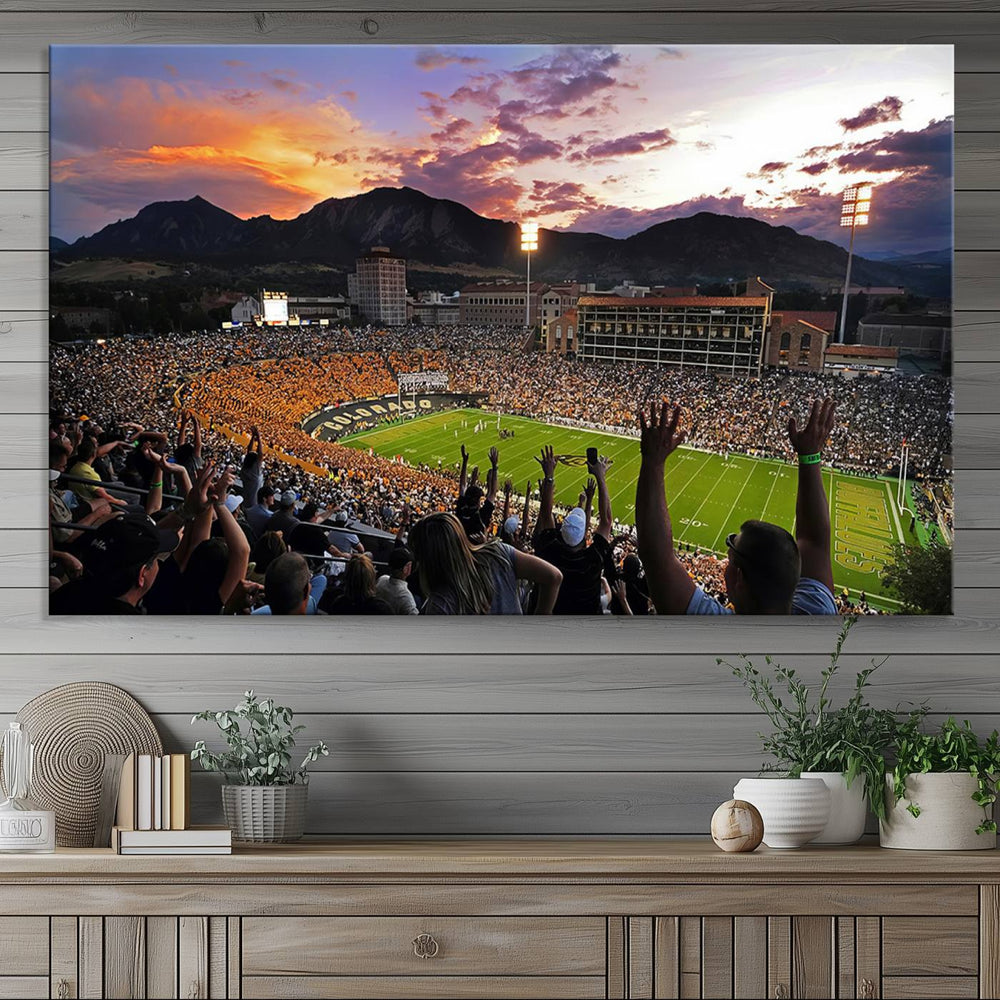 Panoramic image of a vibrant Folsom Field at sunset, with scenic mountains in the background—a breathtaking scene captured perfectly in the "Folsom Field - University of Colorado Buffaloes Football Stadium Wall Art Canvas Print.