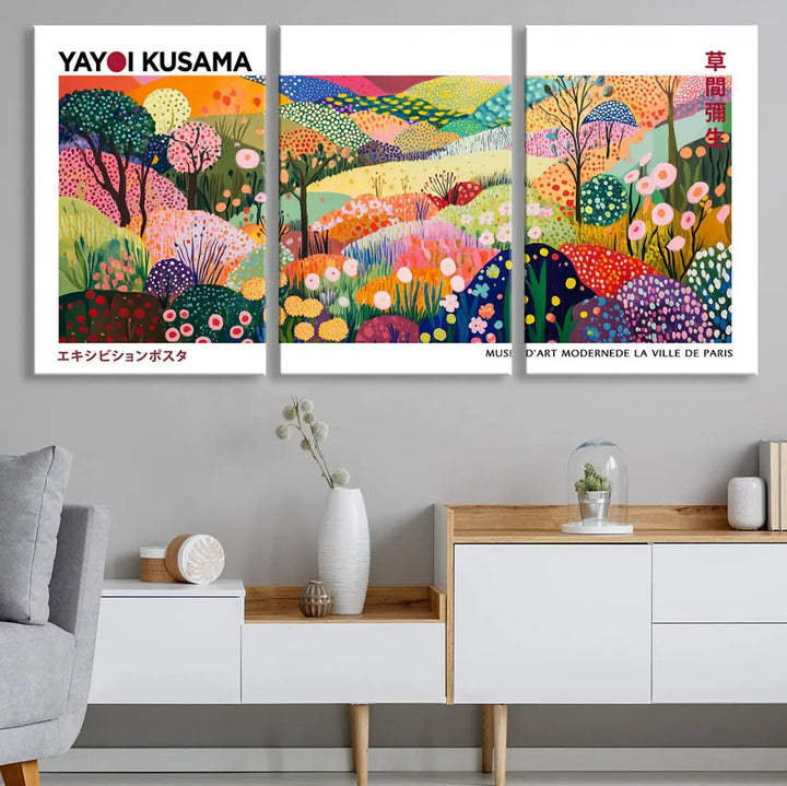 Three vibrant, abstract Yayoi Kusama wall art prints adorn a black wall, creating a perfect blend of contemporary décor.