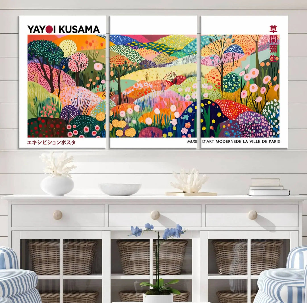 Three vibrant, abstract Yayoi Kusama wall art prints adorn a black wall, creating a perfect blend of contemporary décor.