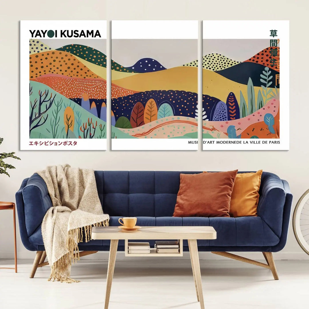 A triptych featuring the Framed Yayoi Kusama 1986 Wall Art Print hangs above. This Japanese Wabi Sabi inspired piece, rich in vibrant abstract landscapes, adds an elegant touch to any nature-inspired décor.