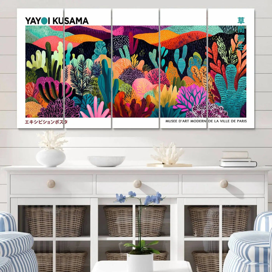 A cozy living room features colorful wall art, with the Framed Yayoi Kusama 1986 Wall Art Print taking center stage. This vibrant abstract landscape canvas seamlessly blends with the contemporary décor, creating a lively yet harmonious atmosphere.