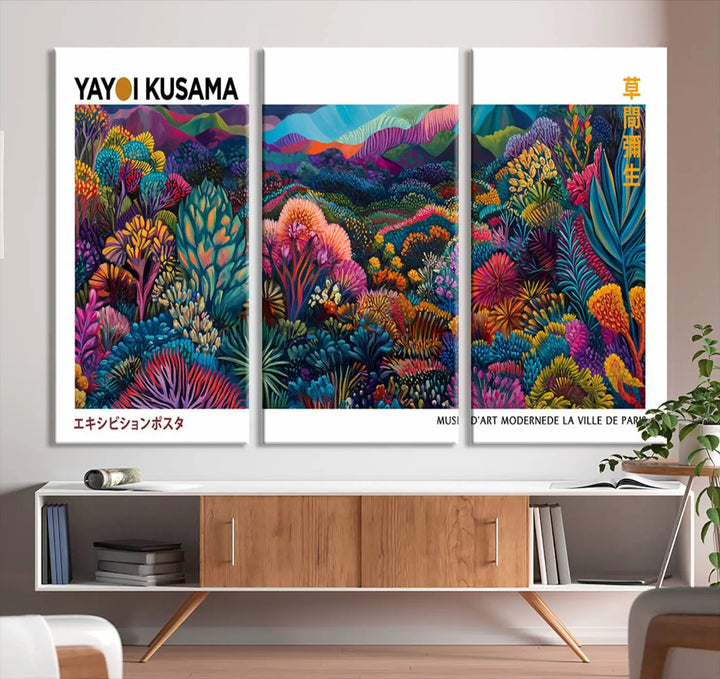 A set of three vibrant abstract landscape canvas prints, inspired by Yayoi Kusama's style and capturing a Japanese Wabi Sabi aesthetic, adorns the dark wall, creating a stunning piece of contemporary décor.