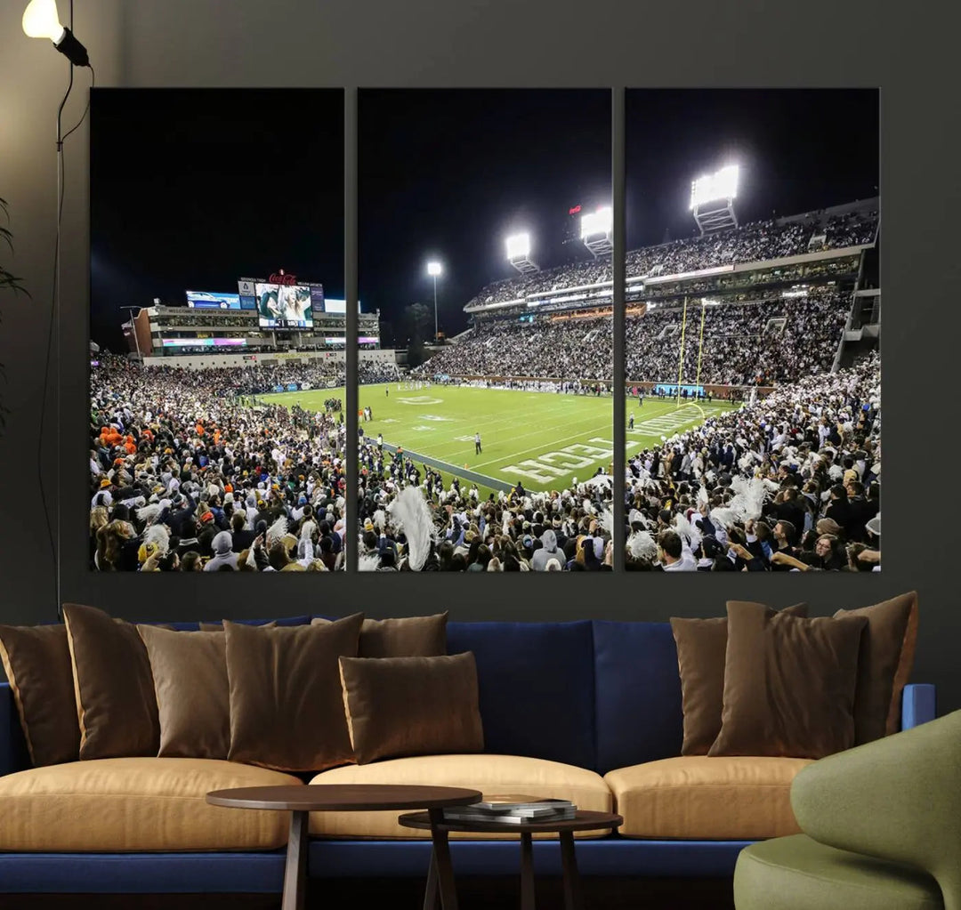 Showcased as premium wall art, this gallery-quality canvas features a print of the Georgia Tech Yellow Jackets Football Team at Atlanta's Bobby Dodd Stadium during a crowded, illuminated night game.