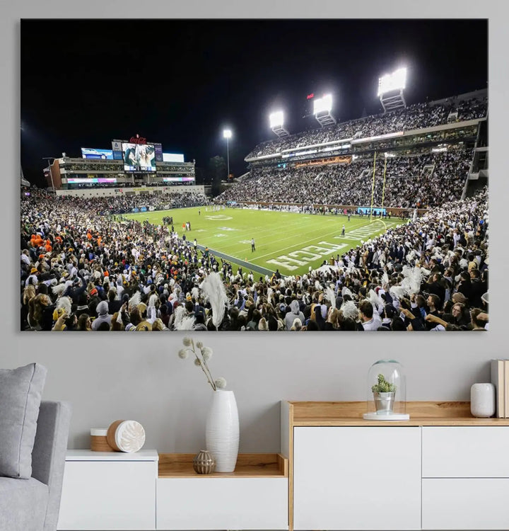 Showcased as premium wall art, this gallery-quality canvas features a print of the Georgia Tech Yellow Jackets Football Team at Atlanta's Bobby Dodd Stadium during a crowded, illuminated night game.