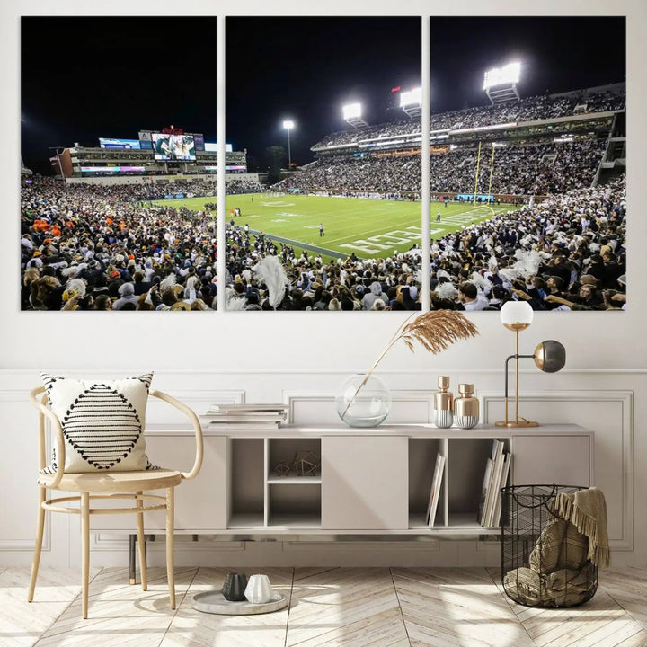 Showcased as premium wall art, this gallery-quality canvas features a print of the Georgia Tech Yellow Jackets Football Team at Atlanta's Bobby Dodd Stadium during a crowded, illuminated night game.