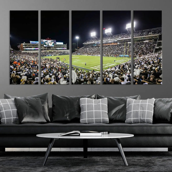 Showcased as premium wall art, this gallery-quality canvas features a print of the Georgia Tech Yellow Jackets Football Team at Atlanta's Bobby Dodd Stadium during a crowded, illuminated night game.