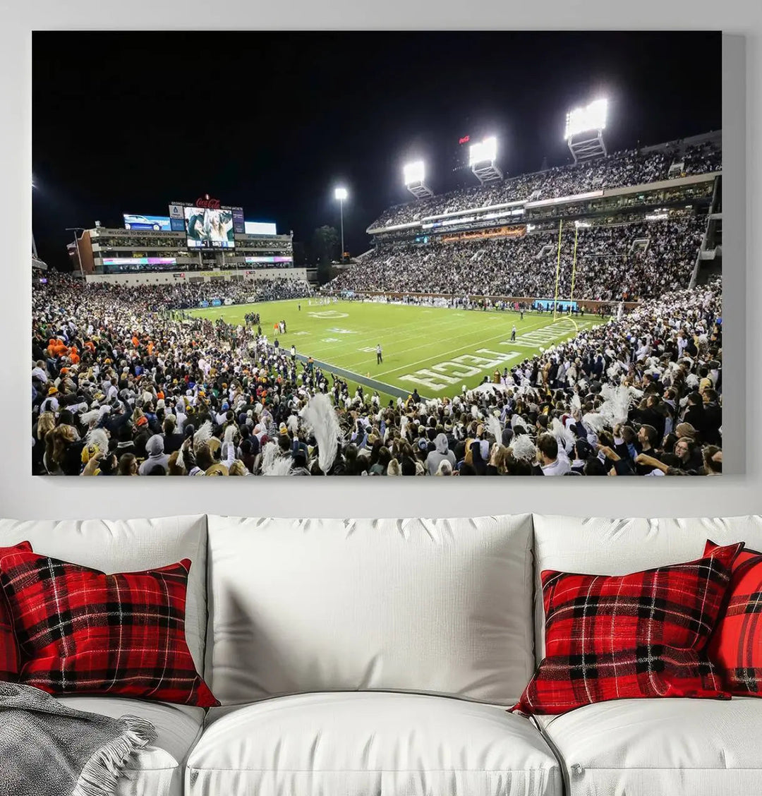 Showcased as premium wall art, this gallery-quality canvas features a print of the Georgia Tech Yellow Jackets Football Team at Atlanta's Bobby Dodd Stadium during a crowded, illuminated night game.