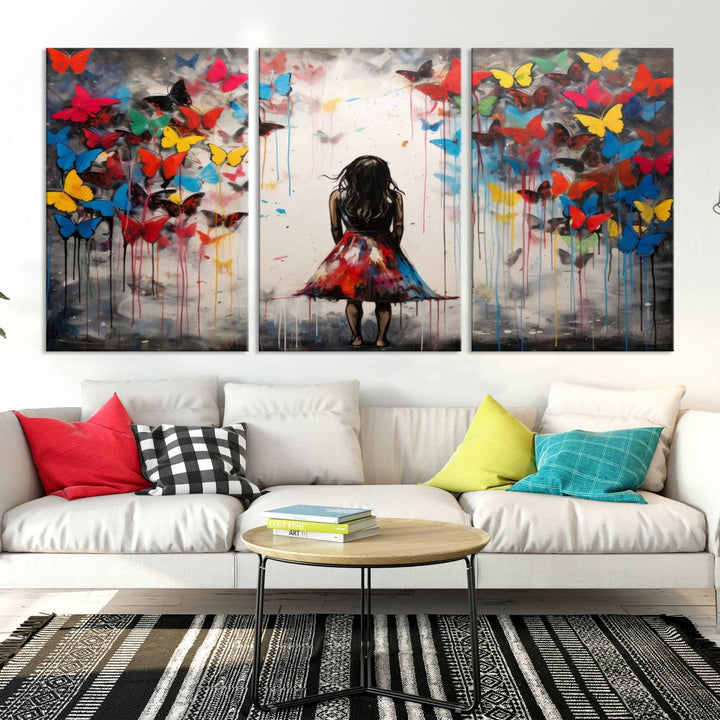 The Girl Butterfly Graffiti Abstract Canvas Print, featuring a vibrant depiction of a girl surrounded by butterflies on museum-quality canvas, is displayed prominently.