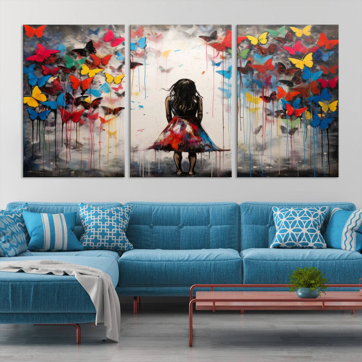 The Girl Butterfly Graffiti Abstract Canvas Print, featuring a vibrant depiction of a girl surrounded by butterflies on museum-quality canvas, is displayed prominently.