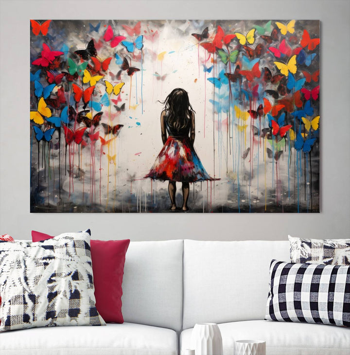 The Girl Butterfly Graffiti Abstract Canvas Print, featuring a vibrant depiction of a girl surrounded by butterflies on museum-quality canvas, is displayed prominently.