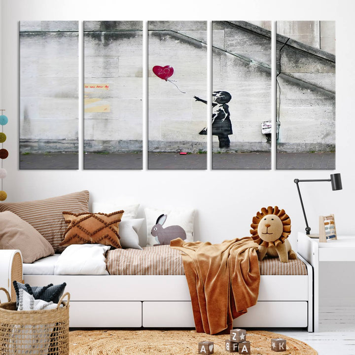 The "Girl with a Balloon Banksy Street Graffiti Art Canvas Print" is a gallery-quality wall art piece that features an image of a girl releasing a heart-shaped balloon. Handmade in the USA, this canvas artwork brings charm and emotion to any room.