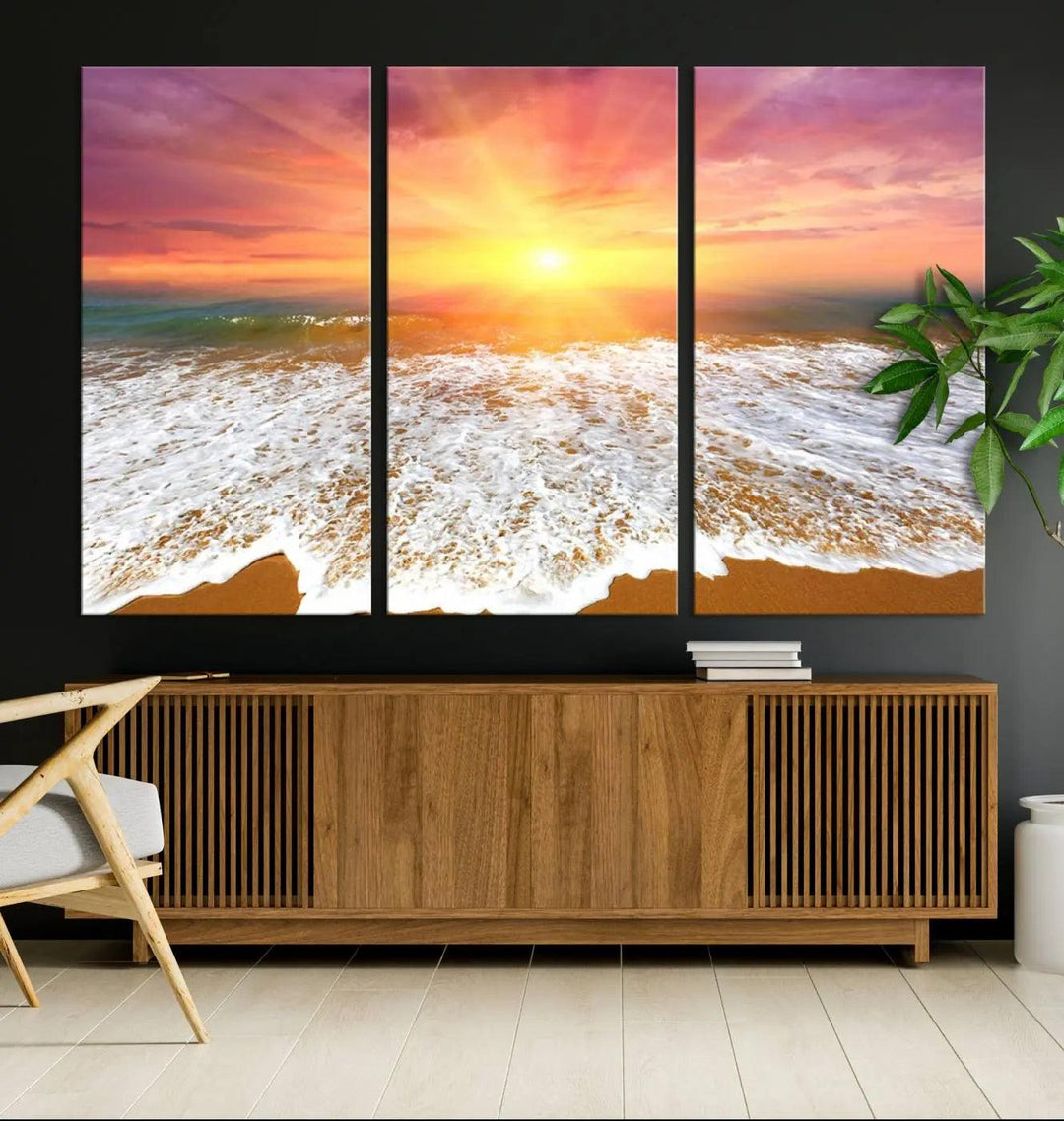 The "Golden Beach Sunrise Canvas Wall Art," a three-panel giclee print featuring ocean waves on a sandy shore, beautifully adorns the gray wall.