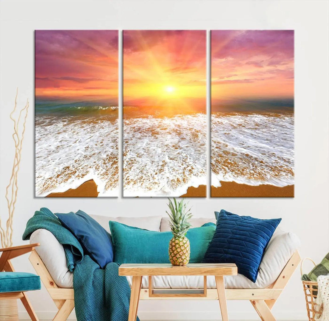 The "Golden Beach Sunrise Canvas Wall Art," a three-panel giclee print featuring ocean waves on a sandy shore, beautifully adorns the gray wall.