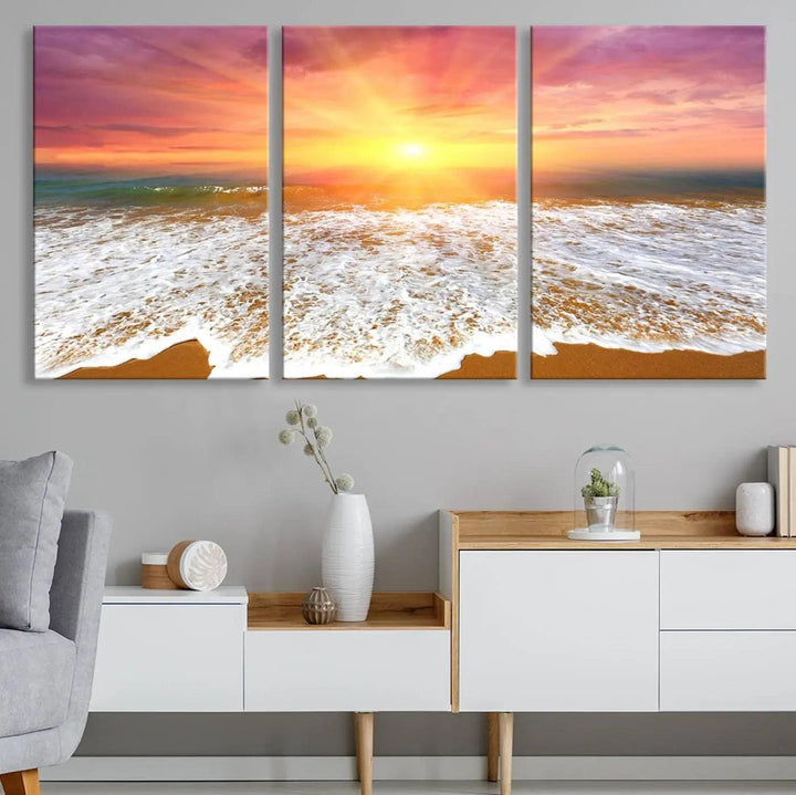 The "Golden Beach Sunrise Canvas Wall Art," a three-panel giclee print featuring ocean waves on a sandy shore, beautifully adorns the gray wall.