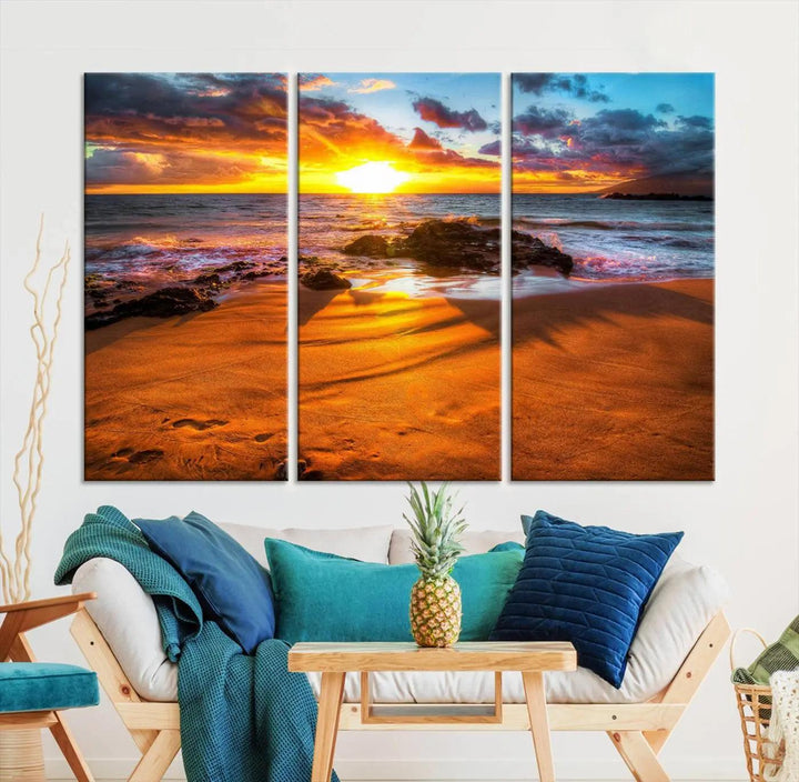 The vibrant panoramic view captured in the Golden Beach Sunset Canvas Art offers a serene scene of nature's tranquil beauty over the rocky shoreline. This Giclee canvas print, featuring a gallery wrap, beautifully depicts a breathtaking seascape for your space.