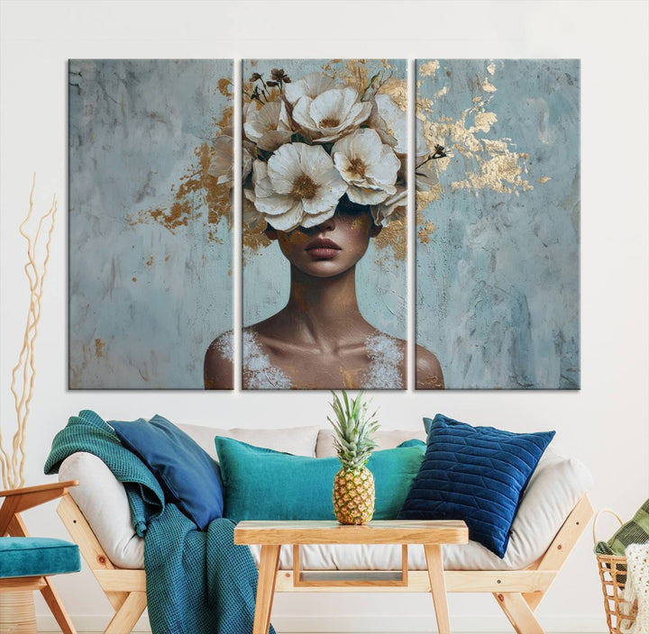 Golden Petal Wall Art: a stunning 3-panel canvas featuring a woman adorned with flowers.